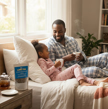 Load image into Gallery viewer, Father and daughter enjoying 92+ Lung Tea lung detox blend for respiratory health in cozy home setting