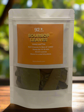 Load image into Gallery viewer, Soursop Leaves by 92+ Health, premium herbal tea packaging on a wooden table with natural background.

